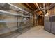 An unfinished basement with exposed pipes, metal shelving units for storage, and a concrete floor at 1413 Eastbrooke Way, Marietta, GA 30066