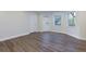 Finished basement with luxury vinyl flooring and a back door next to large windows at 1413 Eastbrooke Way, Marietta, GA 30066