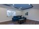 Finished basement living room with a large window, recessed lighting, and a comfortable blue sectional sofa at 1413 Eastbrooke Way, Marietta, GA 30066