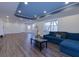 Finished basement with living area and L couch, and luxury vinyl flooring at 1413 Eastbrooke Way, Marietta, GA 30066