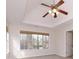 Bedroom boasts a tray ceiling, natural light, and inviting neutral carpeting at 1413 Eastbrooke Way, Marietta, GA 30066