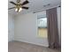 A sunlit bedroom boasts neutral walls, plush carpet, and a ceiling fan at 1413 Eastbrooke Way, Marietta, GA 30066