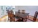 Formal dining room with a large table, six chairs, hardwood floors, and bay window at 1413 Eastbrooke Way, Marietta, GA 30066
