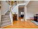 Bright foyer showcasing hardwood floors, staircase and an elegant console table at 1413 Eastbrooke Way, Marietta, GA 30066