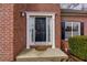 Close-up of a classic black front door framed by white molding and sidelights at 1413 Eastbrooke Way, Marietta, GA 30066