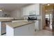 Bright kitchen with granite countertops, stainless steel appliances, and a center island at 1413 Eastbrooke Way, Marietta, GA 30066