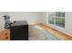 Bright office space featuring wood floors, a large window, and a desk at 1413 Eastbrooke Way, Marietta, GA 30066