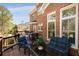 Spacious back deck featuring comfortable seating and a dining area with a view of the yard at 5400 Saint Lyonn Pl, Marietta, GA 30068