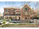 Spacious brick home featuring a balcony, covered patio, and swimming pool at 5400 Saint Lyonn Pl, Marietta, GA 30068