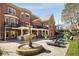 Brick home showcasing backyard with pool, fountain, and outdoor kitchen at 5400 Saint Lyonn Pl, Marietta, GA 30068