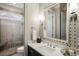 Beautifully tiled bathroom with a glass-enclosed shower and modern fixtures at 5400 Saint Lyonn Pl, Marietta, GA 30068