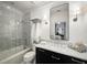 Elegant bathroom showcasing a glass-enclosed shower, sleek vanity with countertop, and decorative mirror at 5400 Saint Lyonn Pl, Marietta, GA 30068