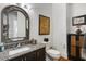 Elegant bathroom with granite countertop, decorative mirror, and intricate wall art at 5400 Saint Lyonn Pl, Marietta, GA 30068