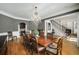 Elegant dining room featuring hardwood floors, a large table, and sophisticated chandelier at 5400 Saint Lyonn Pl, Marietta, GA 30068