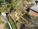 Overhead view of a meticulously manicured garden, featuring gravel pathways and sculpted greenery surrounding a central fountain at 5400 Saint Lyonn Pl, Marietta, GA 30068