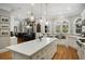 Spacious kitchen featuring a large island, stainless steel appliances, and ample natural light at 5400 Saint Lyonn Pl, Marietta, GA 30068