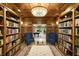Well-appointed library featuring wall-to-wall shelving and a chess table at 5400 Saint Lyonn Pl, Marietta, GA 30068