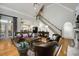 Open-concept living area with hardwood floors, fireplace, and staircase at 5400 Saint Lyonn Pl, Marietta, GA 30068