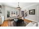 Comfortable living room area with hardwood floors, large windows, and access to other rooms at 5400 Saint Lyonn Pl, Marietta, GA 30068