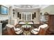 Bright living room with a fireplace, built-in shelving, and comfortable seating arrangement at 5400 Saint Lyonn Pl, Marietta, GA 30068