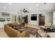 Spacious living room featuring a ceiling fan and built-in shelving units at 5400 Saint Lyonn Pl, Marietta, GA 30068