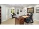 Office with traditional wood desk, wainscoting, and bright windows at 5400 Saint Lyonn Pl, Marietta, GA 30068