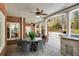Covered outdoor dining area featuring brick columns and an outdoor kitchen at 5400 Saint Lyonn Pl, Marietta, GA 30068