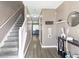 Inviting foyer with staircase, light-colored walls and flooring, and stylish decor at 7158 Georges Way, Morrow, GA 30260