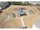 An aerial view of the community amenity area featuring a playground, picnic pavilion and covered patio areas at 1784 Treymire Ct, Stone Mountain, GA 30088