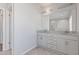 Clean bathroom featuring double vanity with granite countertop and tiled floor at 1784 Treymire Ct, Stone Mountain, GA 30088