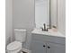 Small half bathroom with gray vanity and faucet at 1784 Treymire Ct, Stone Mountain, GA 30088