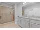 Bright bathroom with tiled shower, granite counters, and modern vanity at 1784 Treymire Ct, Stone Mountain, GA 30088