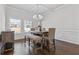 Elegant dining room with modern chandelier and natural light at 1784 Treymire Ct, Stone Mountain, GA 30088