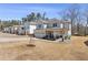 Attractive two-story home with covered front porch, rocking chairs, and well-kept lawn at 1784 Treymire Ct, Stone Mountain, GA 30088