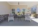 Inviting front porch featuring comfortable seating and stylish decor at 1784 Treymire Ct, Stone Mountain, GA 30088