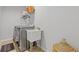Functional laundry room with washer, dryer, sink, and storage for household needs at 1784 Treymire Ct, Stone Mountain, GA 30088