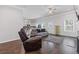 Open-concept living room with hardwood floors and comfortable seating at 1784 Treymire Ct, Stone Mountain, GA 30088