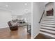 Open concept living room with staircase and modern decor at 1784 Treymire Ct, Stone Mountain, GA 30088