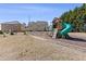 Community playground with slide, swings, and climbing structure at 1784 Treymire Ct, Stone Mountain, GA 30088