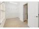 Walk-in closet offers ample storage space with built-in shelving and natural light at 2802 Nettle Ln, Buford, GA 30519