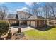Home exterior with brick, siding, 2 car garage and extensive driveway at 2802 Nettle Ln, Buford, GA 30519