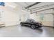 Garage with built in cabinets and a black convertible car at 2802 Nettle Ln, Buford, GA 30519