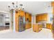 Spacious kitchen with stainless steel appliances, wooden cabinets, and a large island at 2802 Nettle Ln, Buford, GA 30519