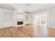 Spacious living room with fireplace and built-in bookshelves features hardwood floors and plenty of natural light at 2802 Nettle Ln, Buford, GA 30519