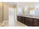 A spacious main bathroom featuring dual sinks, vanity, and glass shower at 2802 Nettle Ln, Buford, GA 30519