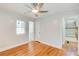 Bedroom featuring hardwood floors, neutral paint, and natural light coming from a window at 3433 Keswick Dr, Chamblee, GA 30341