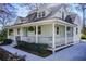 Stylish home with a wraparound porch, perfect for enjoying the outdoors and entertaining at 3433 Keswick Dr, Chamblee, GA 30341