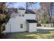 Exterior view of the property, showing the detached building with white siding and dark roof at 3433 Keswick Dr, Chamblee, GA 30341