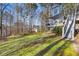 Spacious backyard featuring a multi-level deck and stairs, offering plenty of green space and outdoor enjoyment at 88 Summer Lake Pl, Dallas, GA 30157