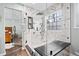 Bathroom featuring a glass shower, marble tile, and a window providing natural light at 88 Summer Lake Pl, Dallas, GA 30157